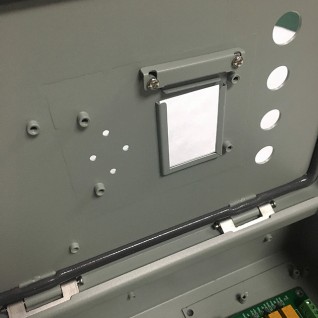 Industrial hinged-door enclosure with lock