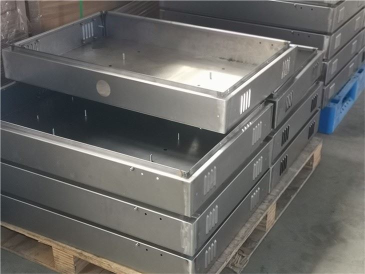 Stacked custom stainless steel metal plates with laser-cut features
